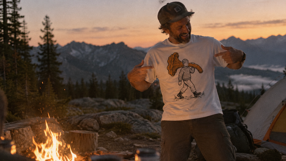 guy camping and laughing